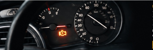 Vehicle dashboard showing a warning light